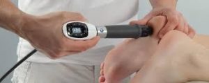 A man performing Shock Wave Therapy